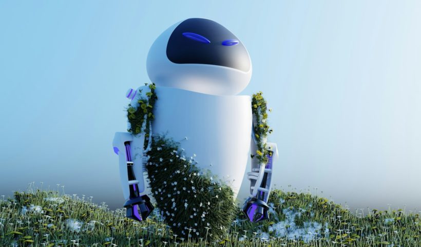 a robot sitting on top of a lush green field